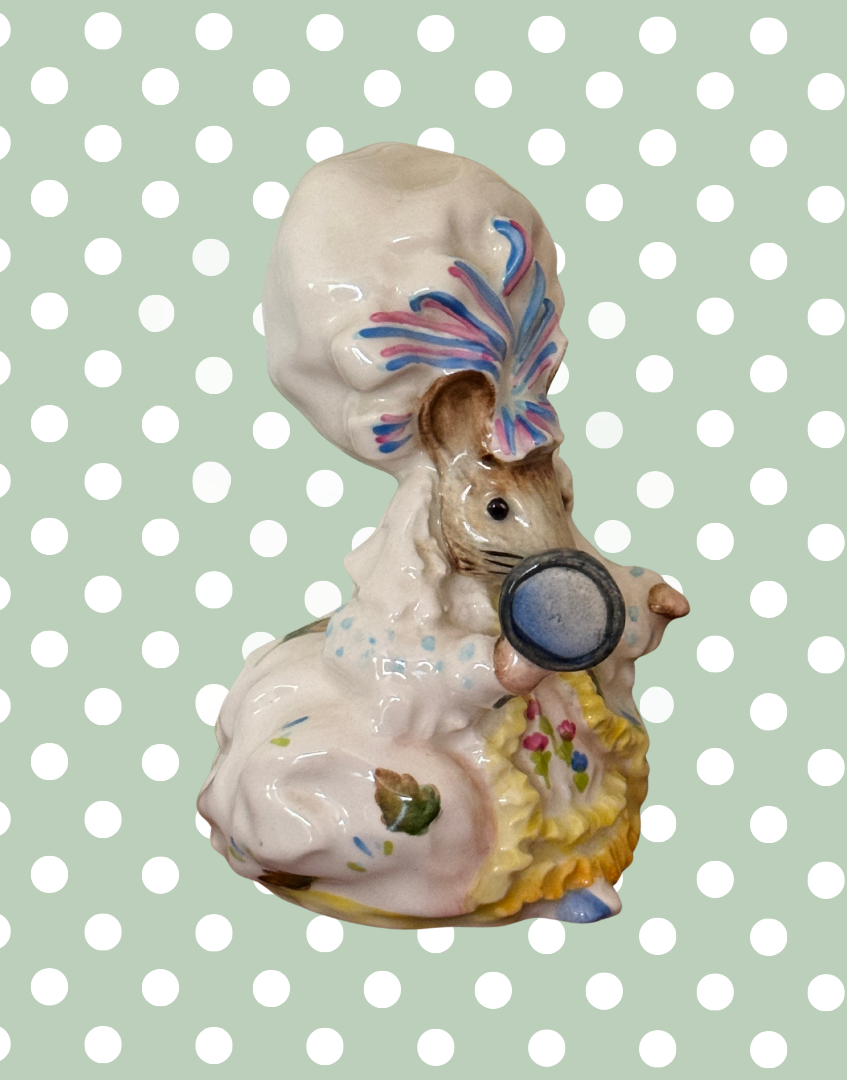 Side view of Beswick Lady Mouse Beatrix Potter figurine holding mirror with beautifully hand-painted costume details