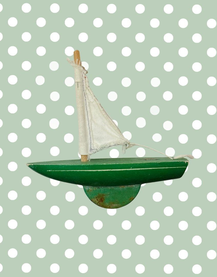 Vintage Star Yachts No. 0 green wooden pond yacht with white sail and original painted finish.