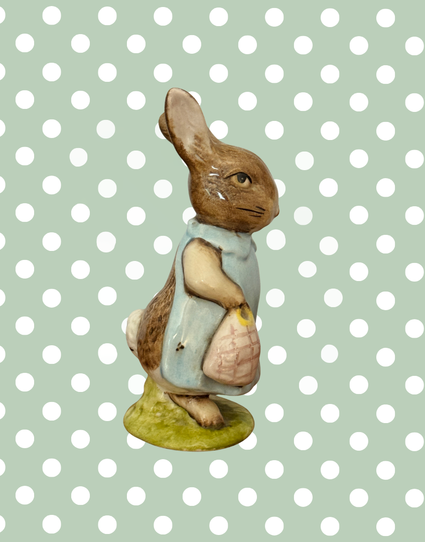 Side view of vintage Beswick Mrs Flopsy Bunny showing her blue clothing and handbag