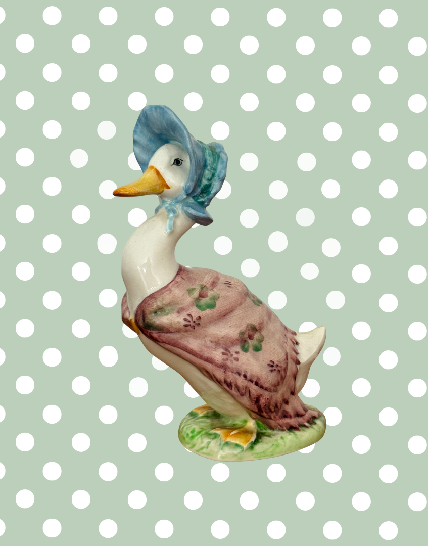 Side view of Beswick Jemima Puddle Duck showing painted decoration and ceramic modelling