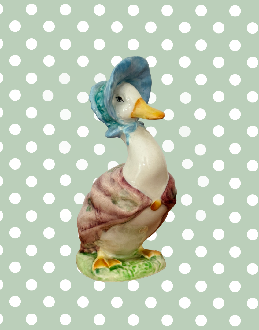 Side view of vintage Beswick Jemima Puddle Duck figurine showing bonnet and shawl detail