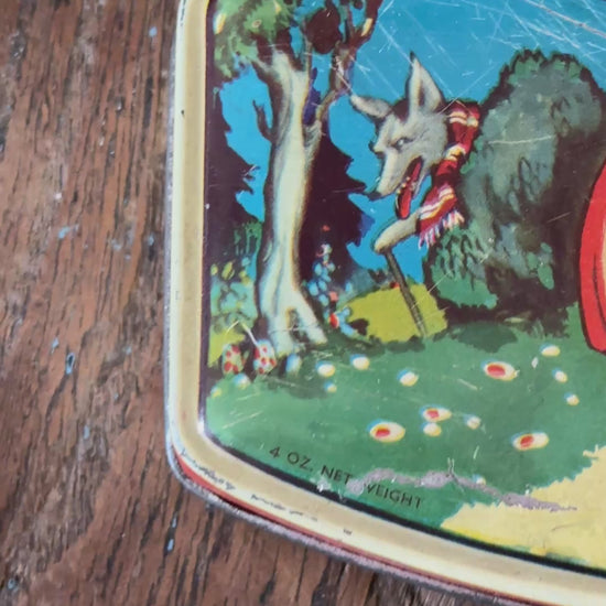 Vintage 1930s Rileys Toffee advertising tin with colourful Little Red Riding Hood fairy tale design and forest scene on lid
