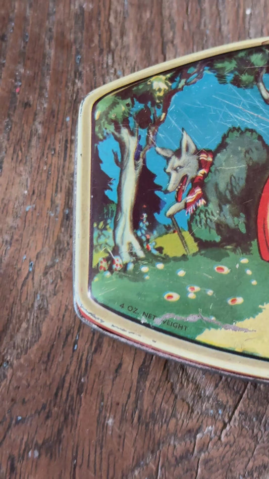 Vintage 1930s Rileys Toffee advertising tin with colourful Little Red Riding Hood fairy tale design and forest scene on lid