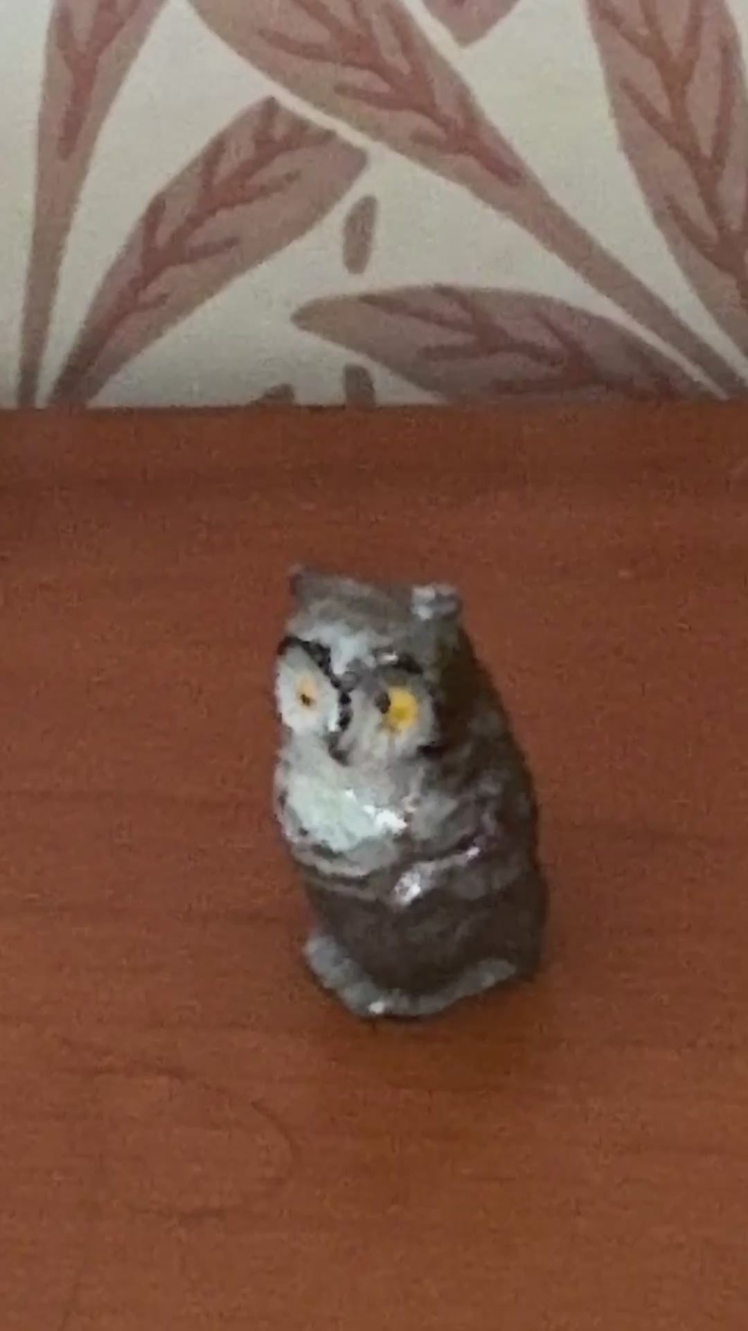 close up of grey and white hand painted lead collectable owl figurine