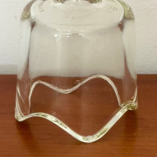 Classic clear Pyrex glass pie vent with fluted base.