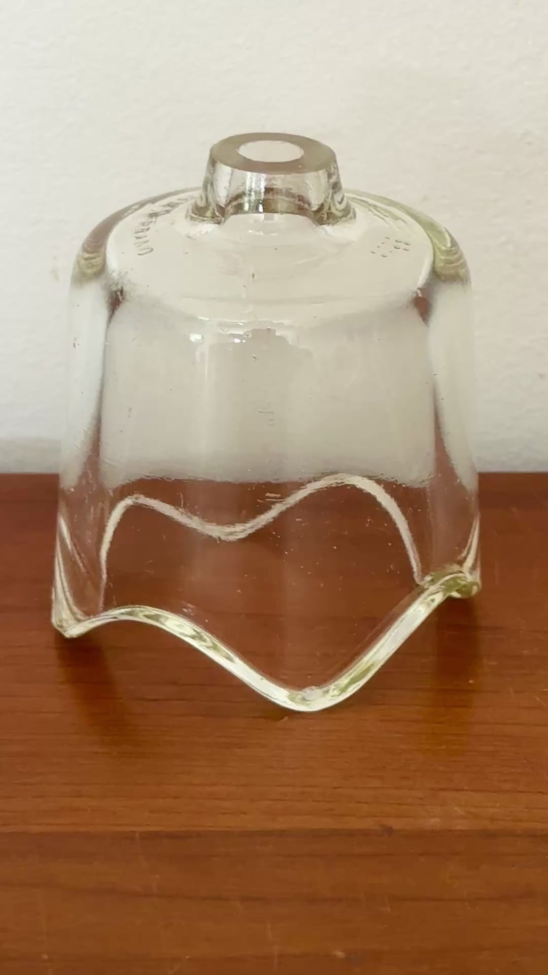 Classic clear Pyrex glass pie vent with fluted base.