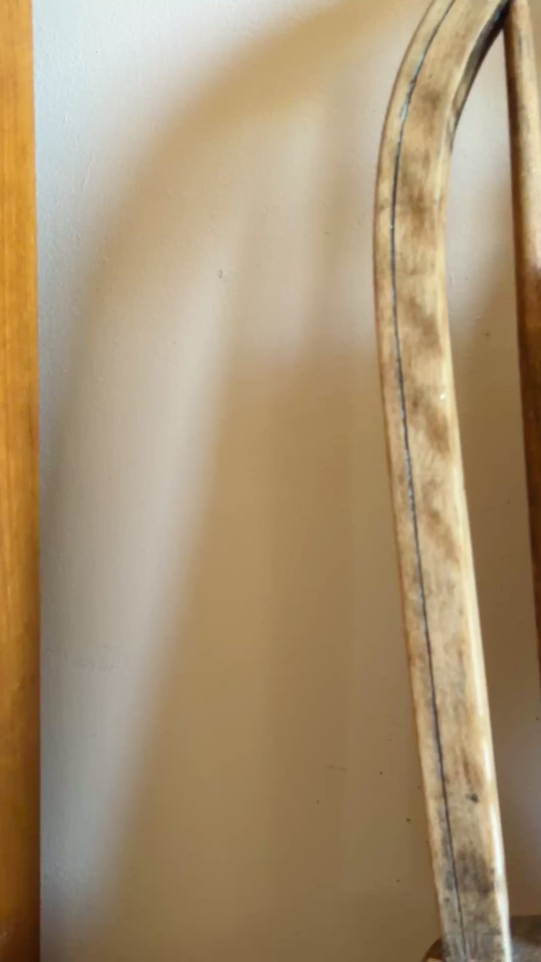 Greek Lunch framed embroidered wall art on antique wooden seat sunny summer display