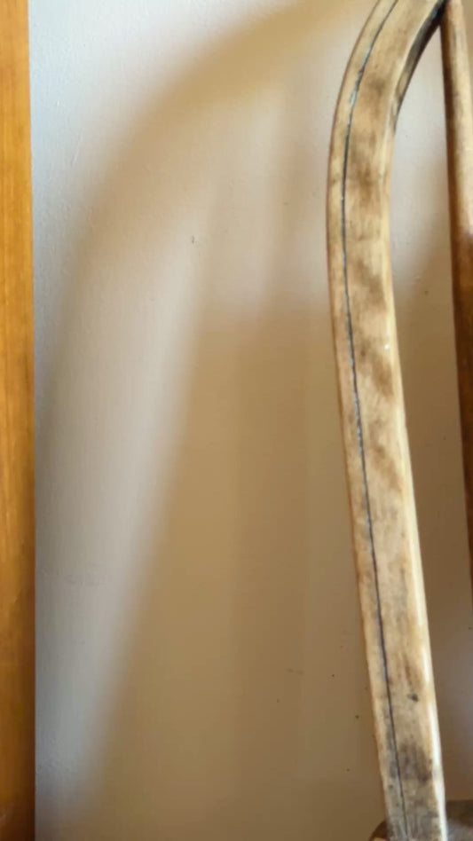 Greek Lunch framed embroidered wall art on antique wooden seat sunny summer display