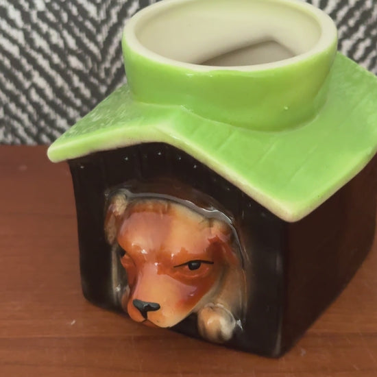 Video showing the Tony Wood dog in kennel egg cup from several angles, including the dog’s face, green roof and cream interior.