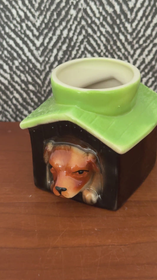 Video showing the Tony Wood dog in kennel egg cup from several angles, including the dog’s face, green roof and cream interior.