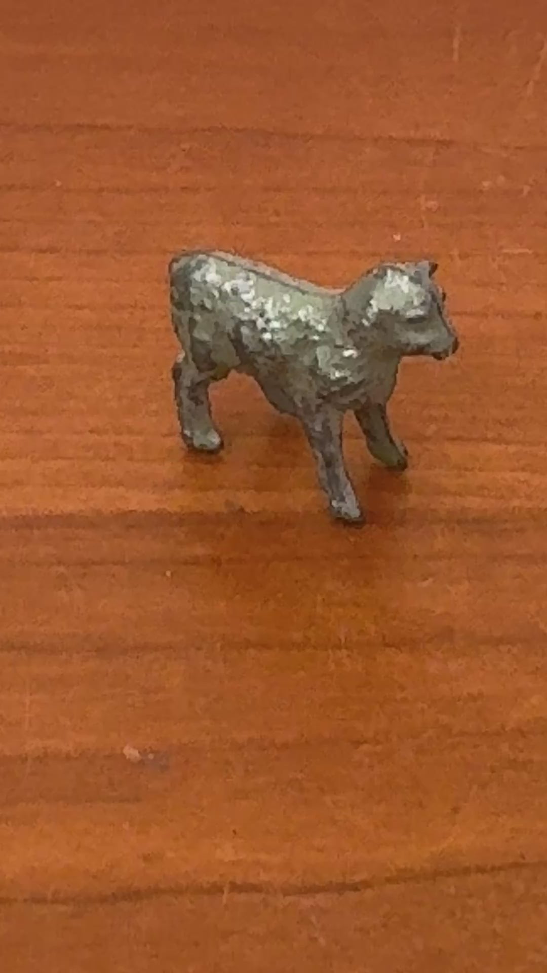 close up of antique lamb lead toy farm figurine