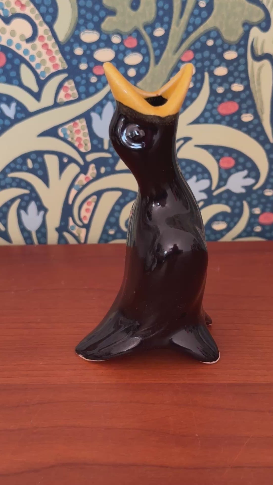 Close up of vintage ceramic glazed black bird pie funnel