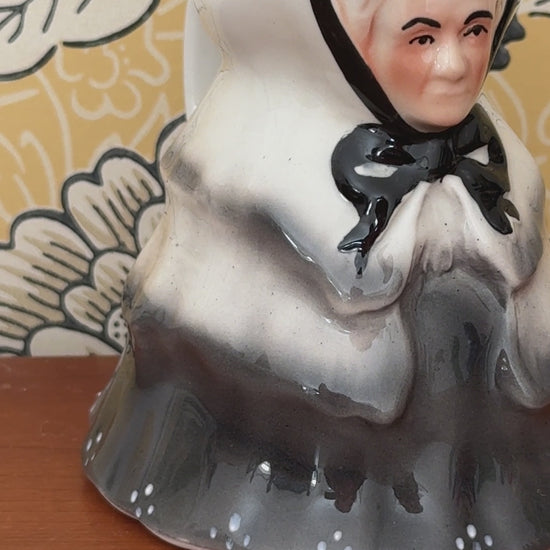 Video showing the Tony Wood Little Old Lady milk jug from several angles, with close views of her face, black bow and grey clothing.