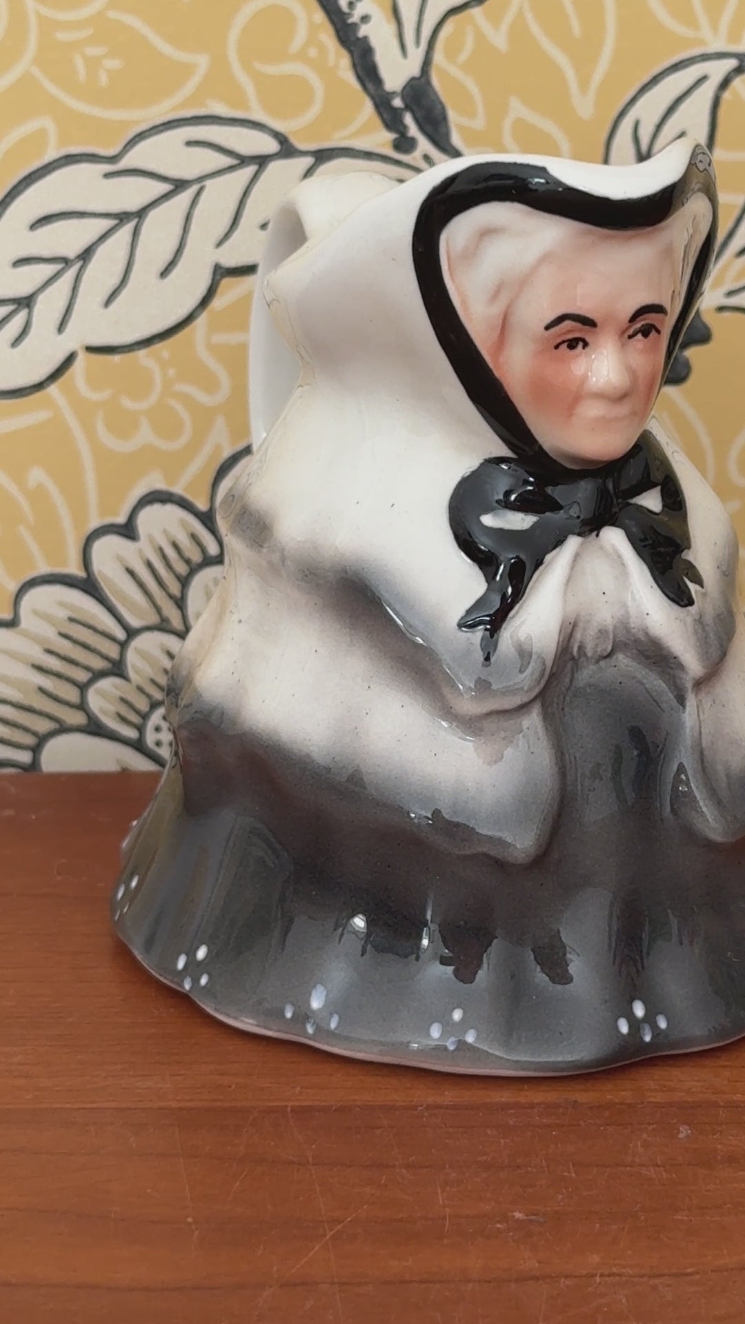 Video showing the Tony Wood Little Old Lady milk jug from several angles, with close views of her face, black bow and grey clothing.
