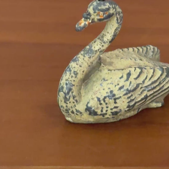 A cream swan swimming, version 2, showing some paint loss but retaining delicate shape and charm. This 1920s Britains figure is an ideal addition for collectors completing a vintage farmyard or waterfowl display.
