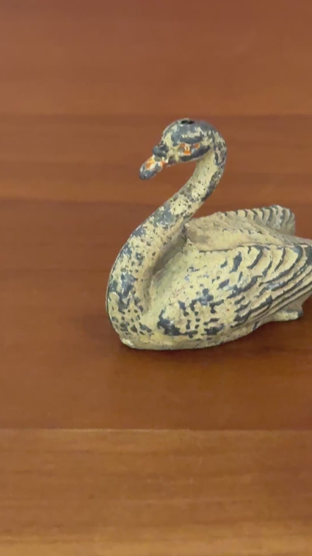 A cream swan swimming, version 2, showing some paint loss but retaining delicate shape and charm. This 1920s Britains figure is an ideal addition for collectors completing a vintage farmyard or waterfowl display.