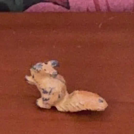 close up of light brown hand painted Britains miniature lead squirrel figurine