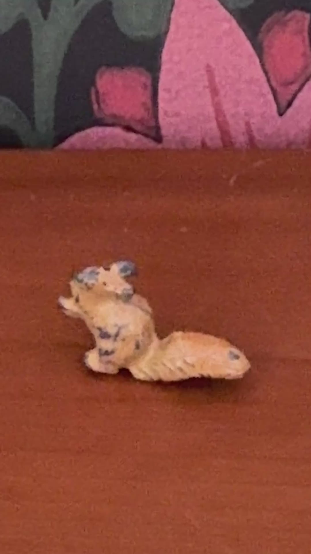 close up of light brown hand painted Britains miniature lead squirrel figurine