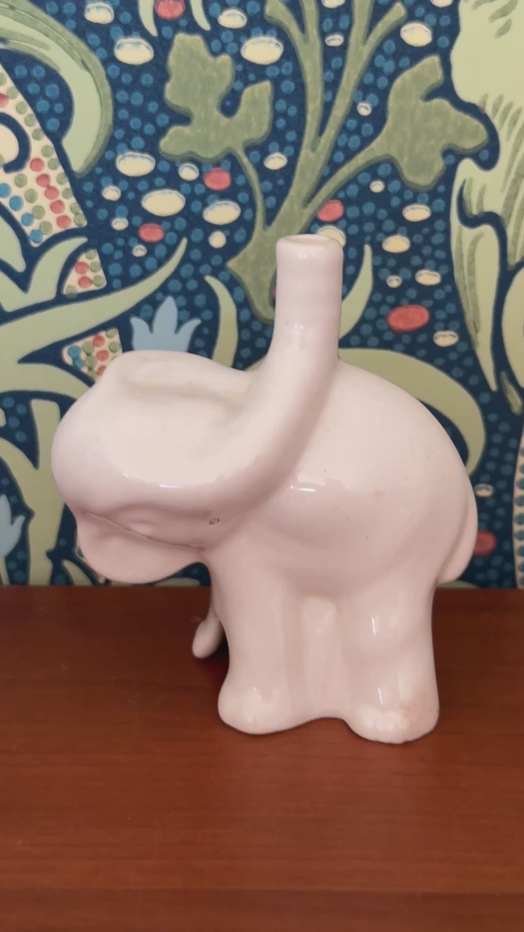 close up video of nutbrown pottery white elephany baking tool