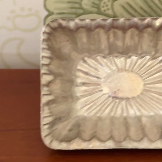 Vintage aluminium chocolate mould from a collection featuring ten individual fluted moulds for traditional confectionery making