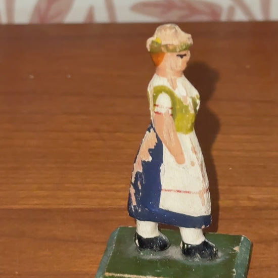 Product description:

A traditional flat wooden toy figure from the Erzgebirge region of Germany, featuring a hand-painted country farm woman. Lovely naive style and gentle signs of age make this a collectible piece of folk toy history.



Product details:

• Origin: Erzgebirge, Germany

• Material: Hand-painted wood

• 1930s



Condition:

Good vintage condition with light paint loss to back. Please refer to images.



Product dimensions:

Height: 5.5cm

Width: 1.5cm