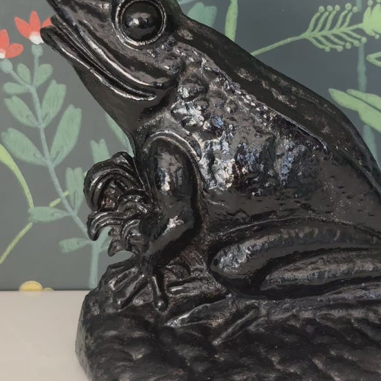 Heavy vintage frog doorstop in black cast iron front display view