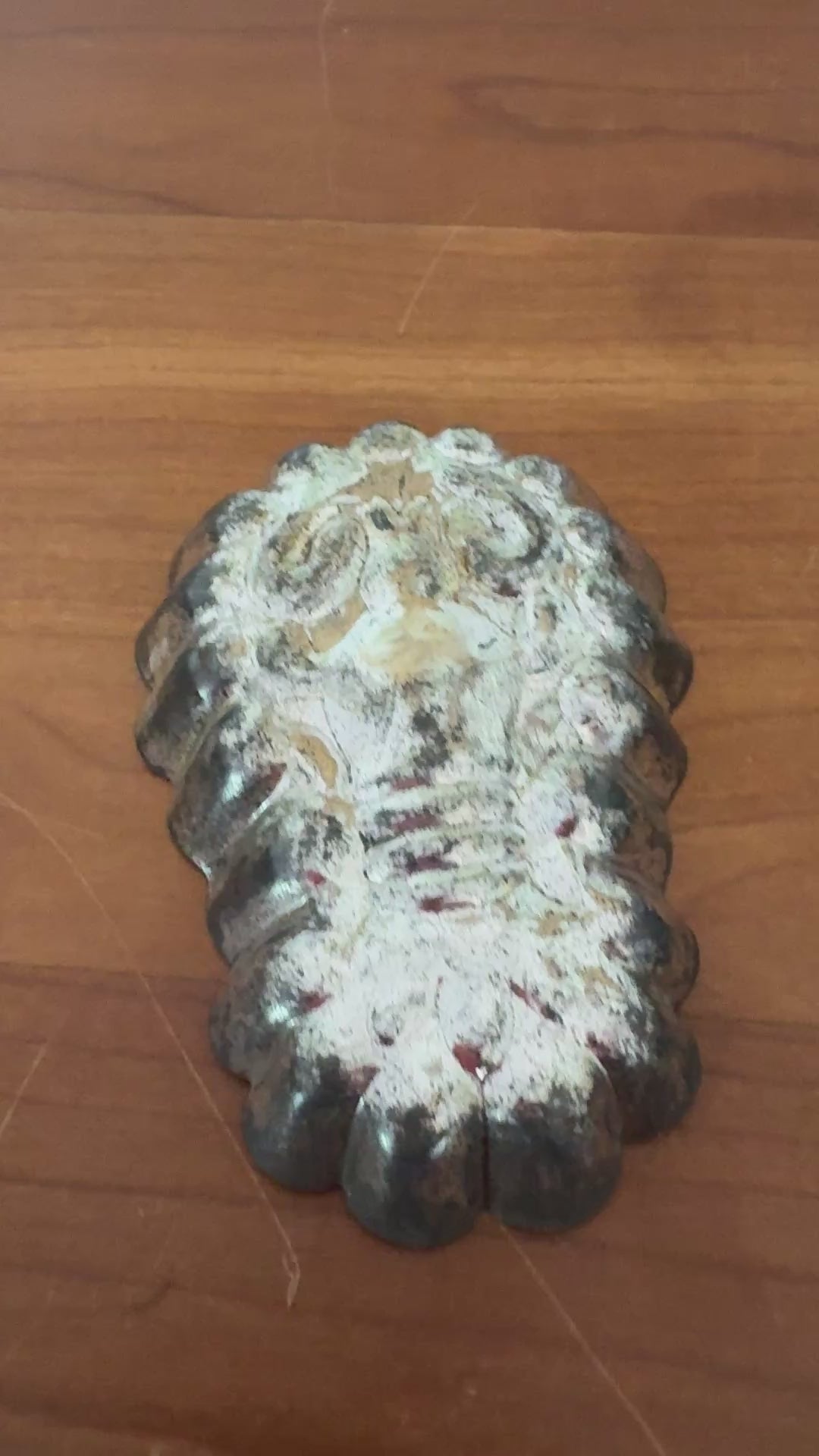 Pair of vintage lobster shaped tinplate moulds with aged metal patina and traditional confectionery design